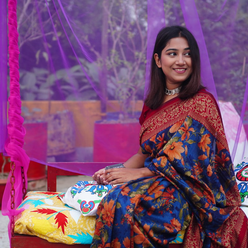 A Woman in Red and Blue Saree Dress